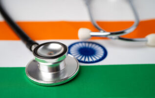 Black stethoscope on India flag background, Business and finance Black stethoscope on India flag background, Business and finance